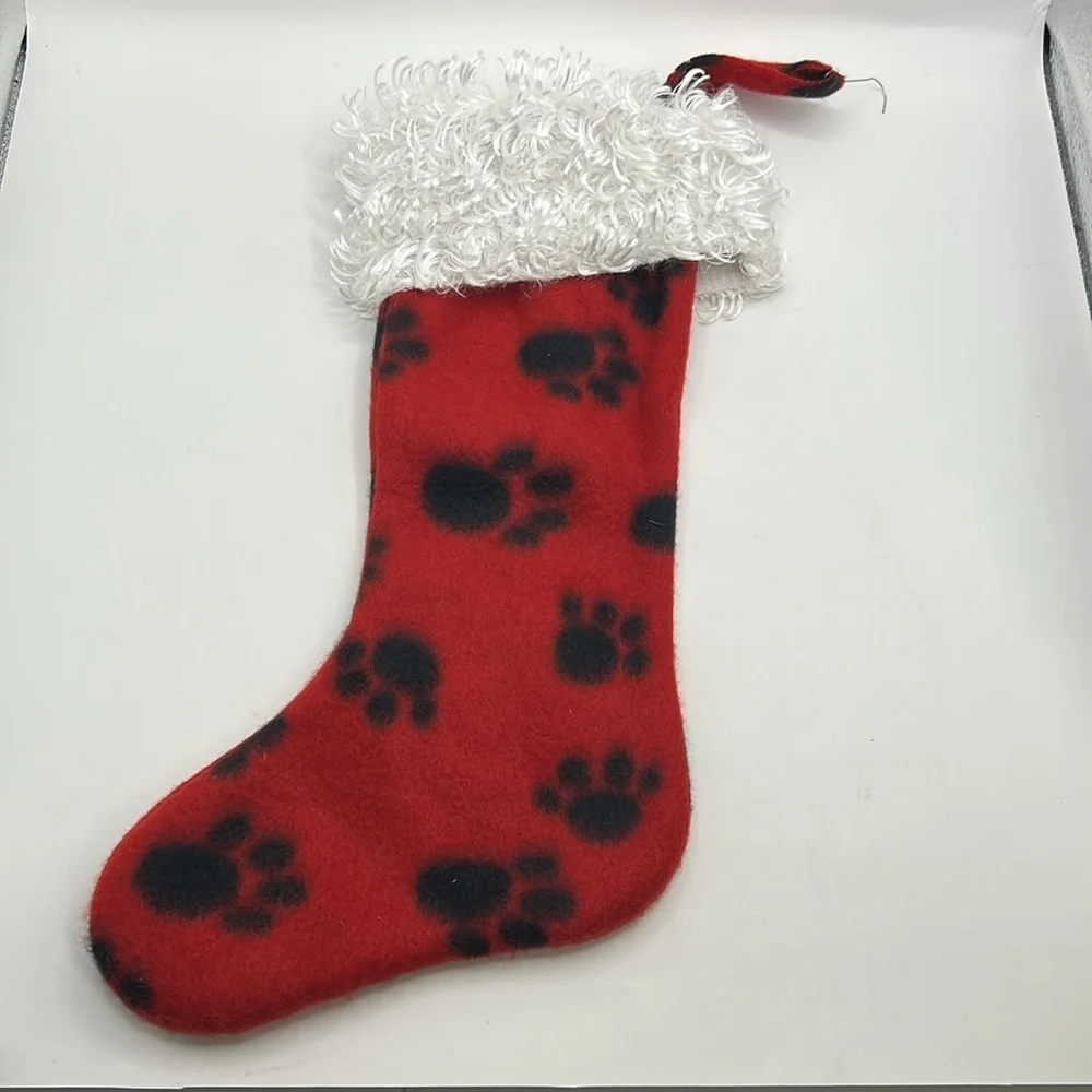Red Christmas Stocking with Black Paw Prints.